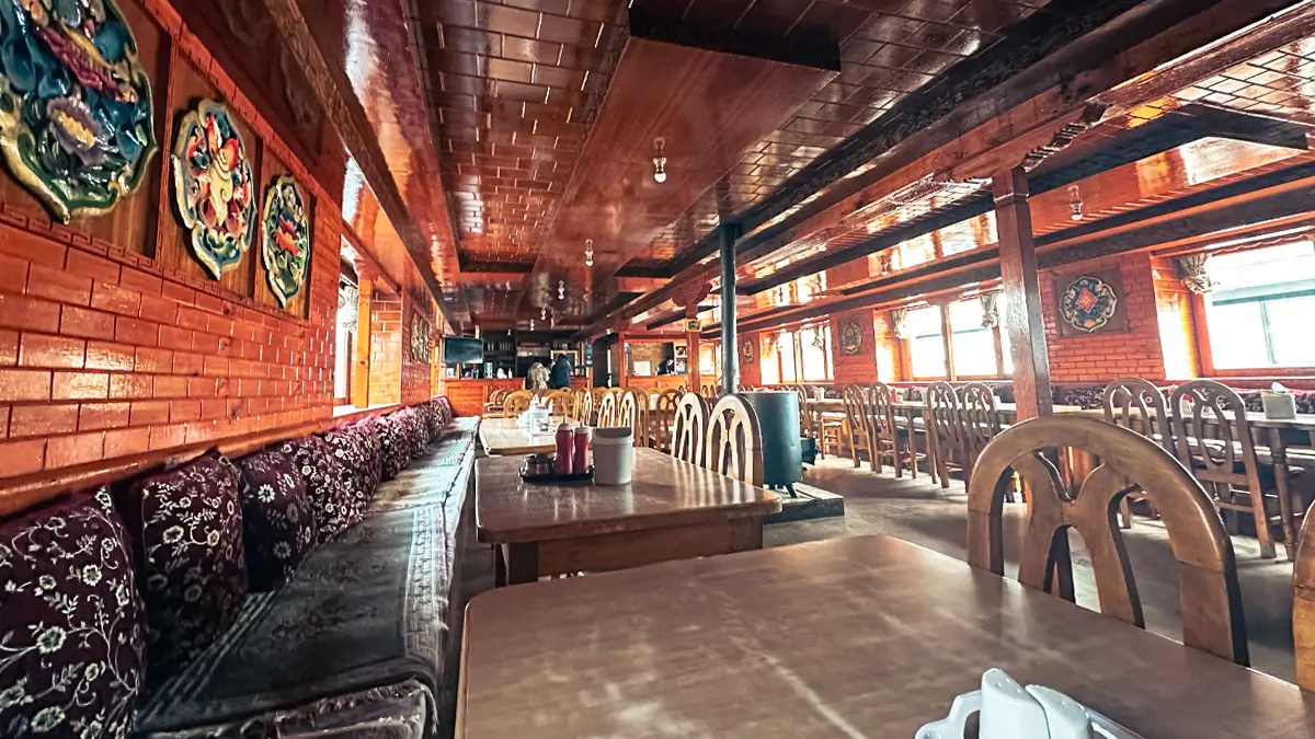 Traditional teahouse in Dingboche village with Himalayan mountains in the background, Everest region, Nepal.