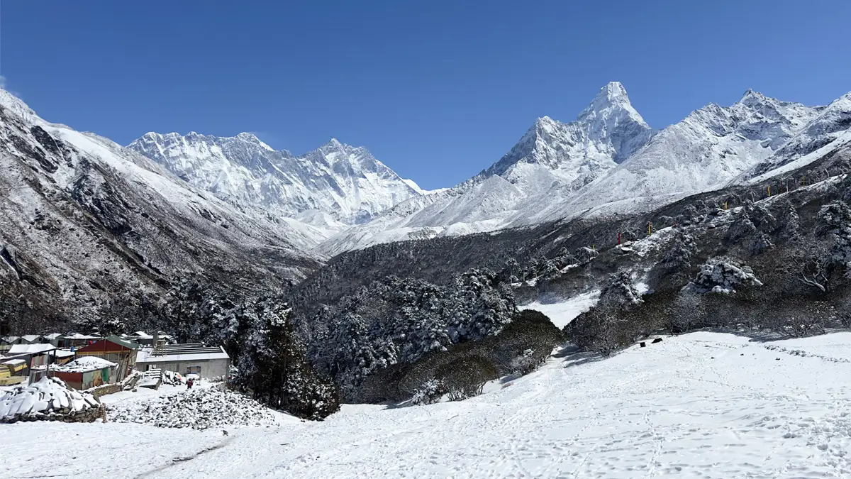 Panoramic view of Mount Everest, Ama Dablam, and surrounding Himalayan peaks from Tengboche Monastery, Nepal.