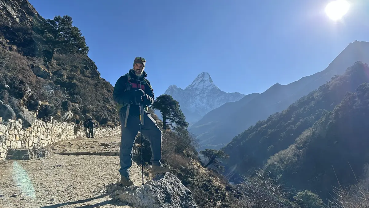 Trekkers walking on the trail from Tengboche to Dingboche on the Everest Base Camp trek