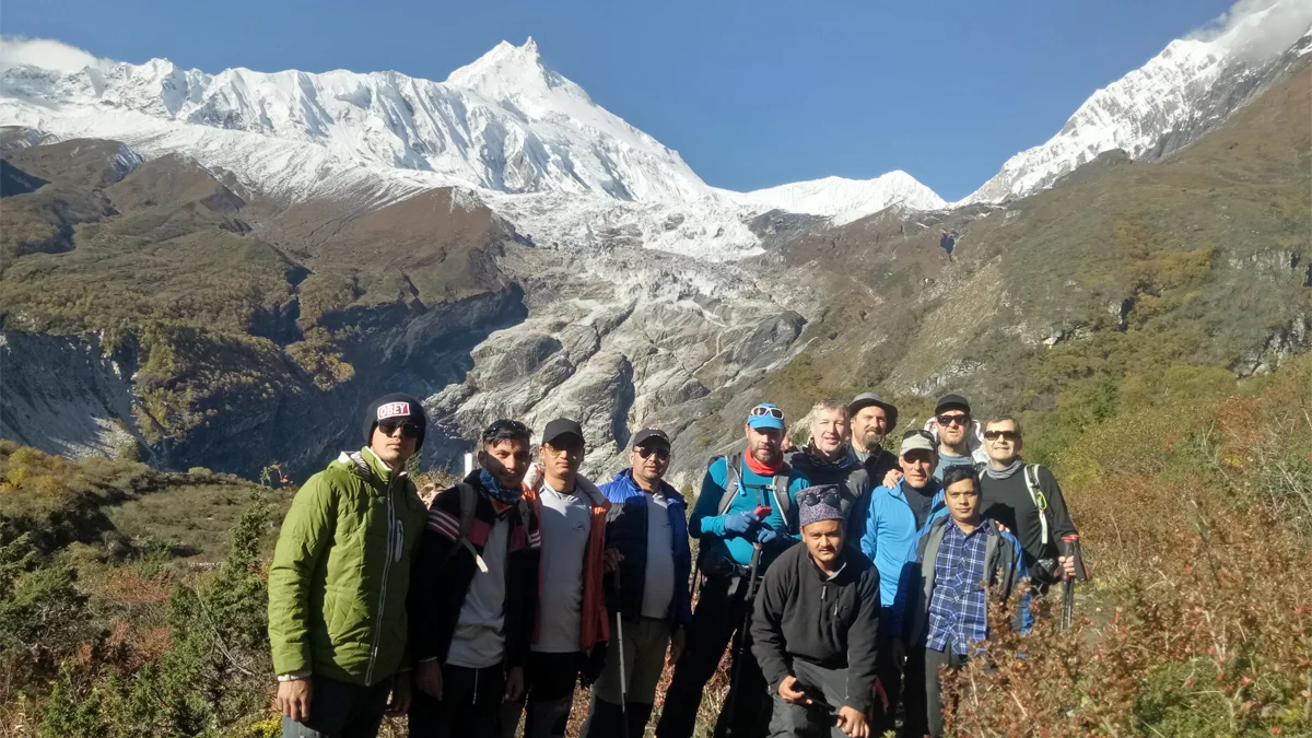 Birendra Lake acclimatization hike at 3,691 meters on Manaslu Circuit trek with mountain reflections