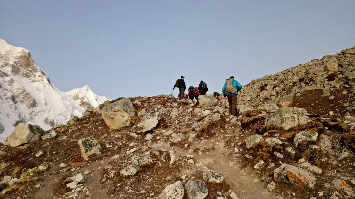 Early morning Larkya Pass crossing in clear weather Manaslu Circuit trek pre-dawn start