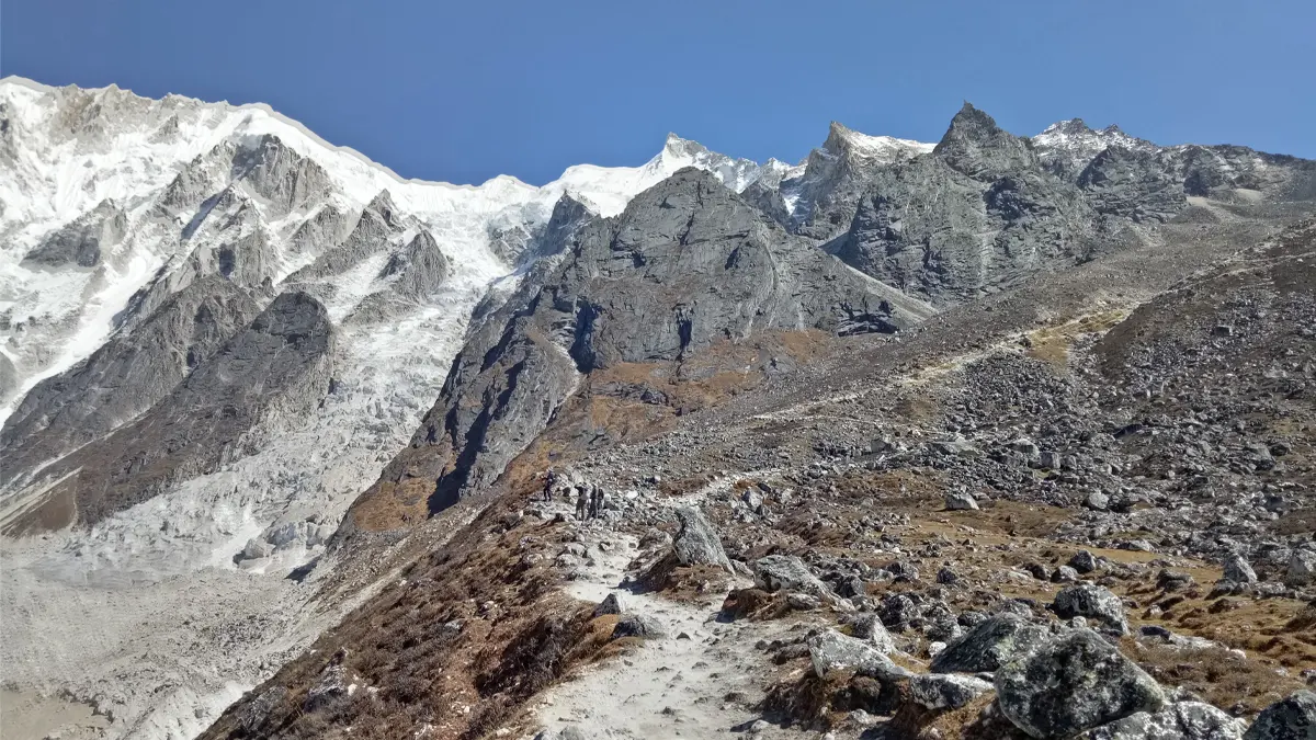 Manaslu Circuit trekking trail between Larkya Pass and Bhimthang descent through rocky terrain