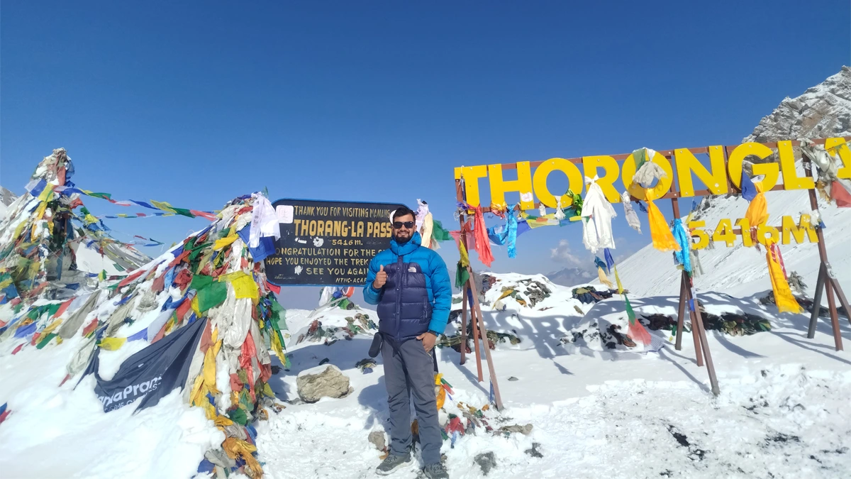 Thorong La Pass at 5,416 meters highest point Annapurna Circuit trek with prayer flags and mountain views