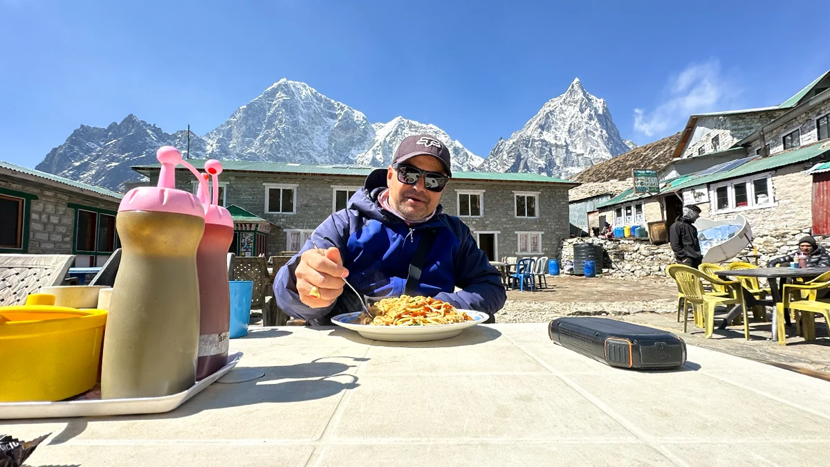 Trekkers having lunch during the Everest Base Camp Trek with mountain views