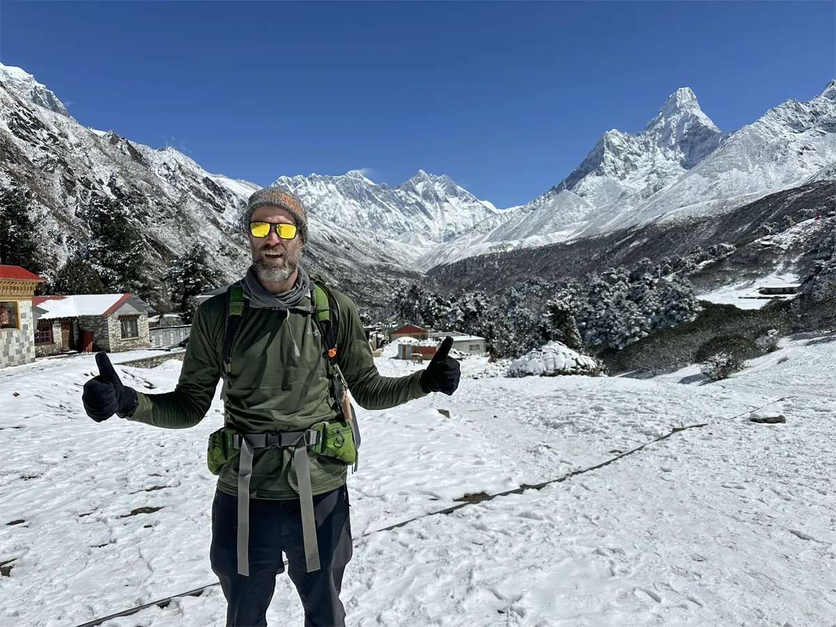 Trekkers on the Everest Base Camp trail with mountain views