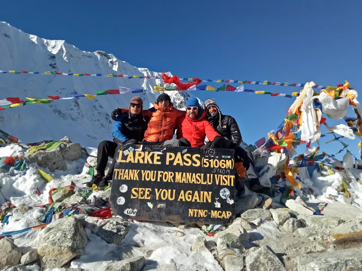 Trekkers crossing Larke Pass on the Manaslu Circuit