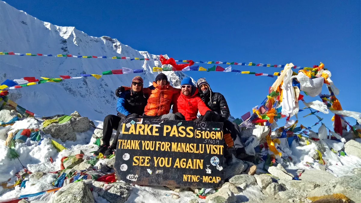 Trekkers standing at Larke Pass in Nepal