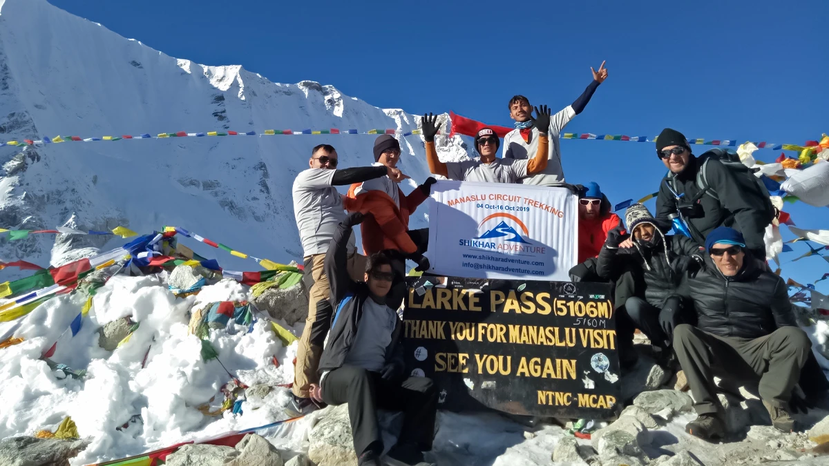 Trekkers crossing Larkya La Pass on the Manaslu Circuit Trek